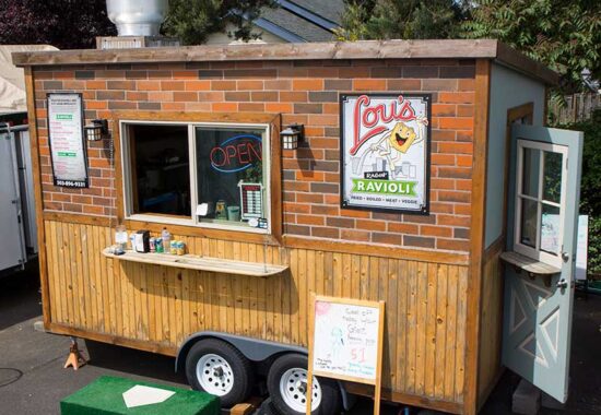 A photo of the Lou's Ragin' Ravioli foodcart, taken by Ink Stained Creative. We also designed the logo and menu.