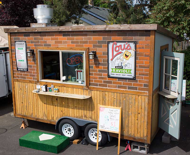 A photo of the Lou's Ragin' Ravioli foodcart, taken by Ink Stained Creative. We also designed the logo and menu.