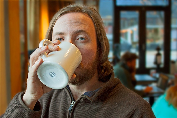 Dave Garlock photo drinking coffee. Dave owns Ink Stained Creative, develops websites, and provides copywriting